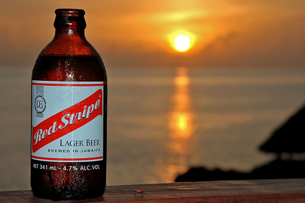 Jamaican Sunset & Red Stripe - Irie Zayne Taxi and Tours Jamaica - www.iriezaynetaxiandtoursjamaica.com - www.IrieZayneTaxiAndToursJamaica.net